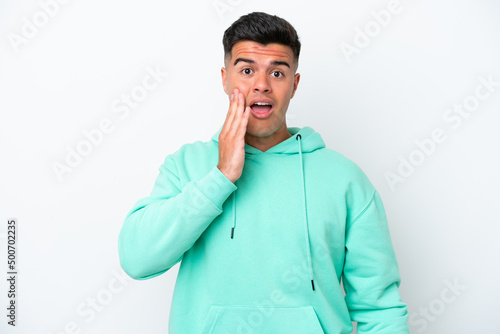 Young caucasian handsome man isolated on white background with surprise and shocked facial expression