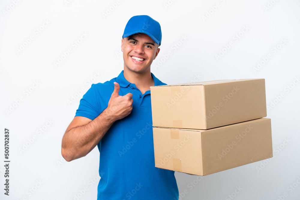Delivery caucasian man isolated on white background giving a thumbs up gesture Delivery caucasian man isolated on white background giving a thumbs up gesture