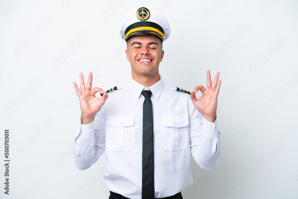 Airplane pilot caucasian man isolated on white background in zen pose Airplane pilot caucasian man isolated on white background in zen pose