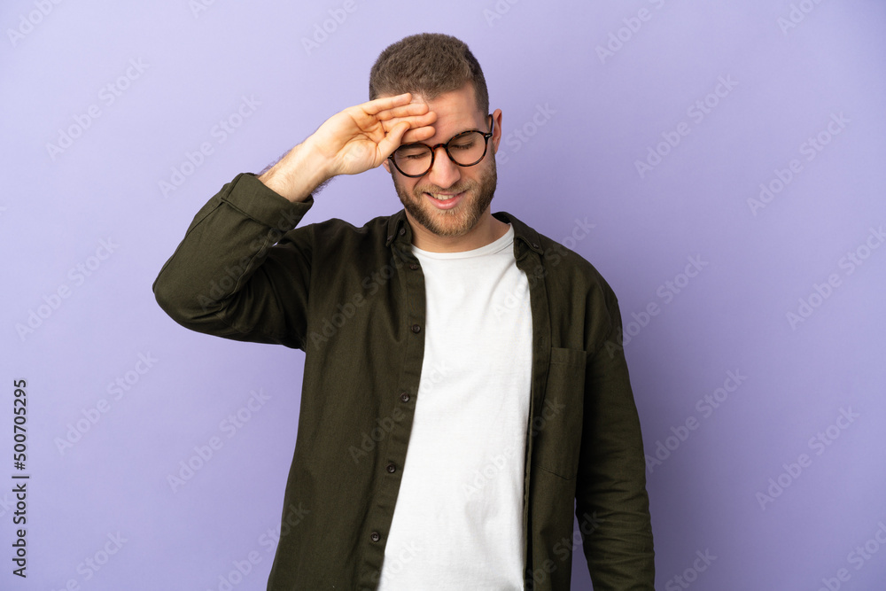 Young handsome caucasian man isolated on purple background with tired and sick expression Young handsome caucasian man isolated on purple background with tired and sick expression