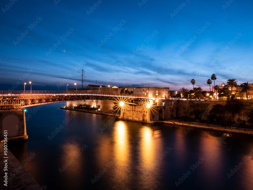 Ponte San Francesco di Paola bridge and Castello Aragonese castle in Taranto, Italy at night