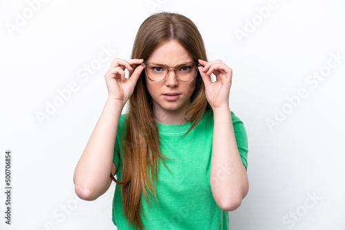 Young caucasian woman isolated on white background With glasses and frustrated expression
