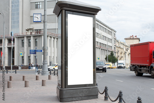 Billboard poster large vertical street. Gray building at the crossroads. Mock-up.