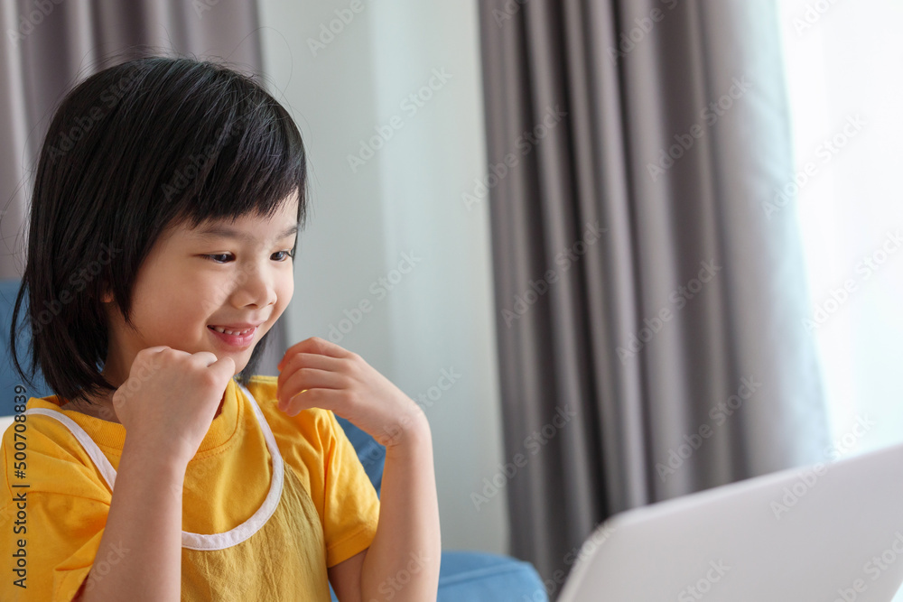 little asian girl student study online using laptop computer at home little asian girl student study online using laptop computer at home