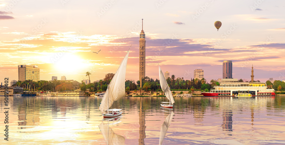 Sailboats in the Nile in front of Cairo TV Tower at sunset, Egypt, Africa