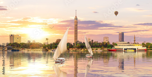 Sailboats in the Nile in front of Cairo TV Tower at sunset, Egypt, Africa