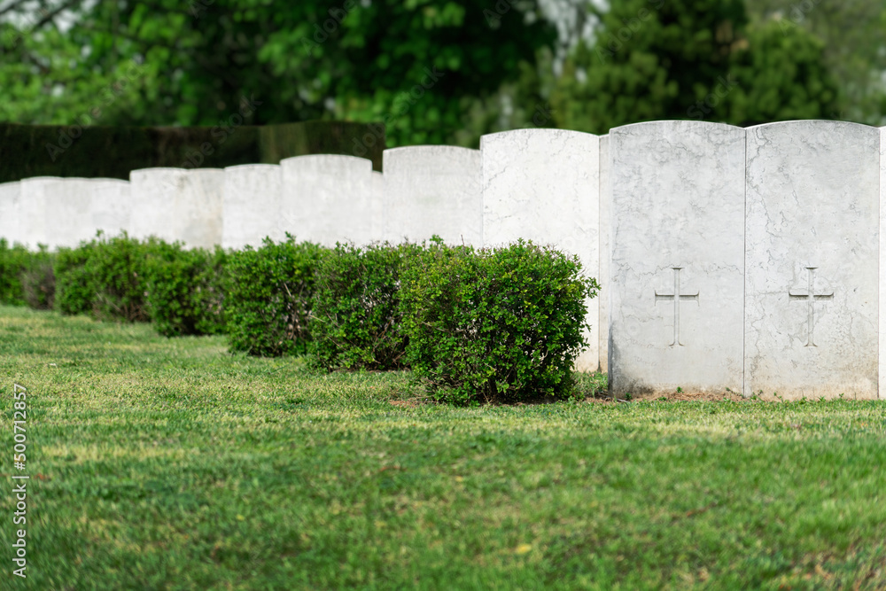 Rows of white tombstones at the military memorial cemetery. Rows of white tombstones at the military memorial cemetery.