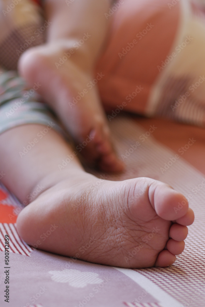 close up of dry child feet on bed , close up of dry child feet on bed ,