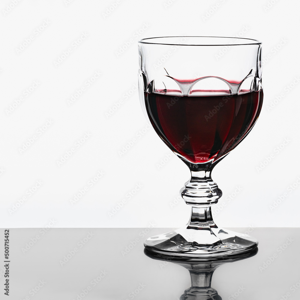 custom made wallpaper toronto digitalPhoto of a wine glass with red wine on a white background.