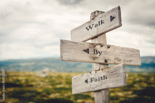 Fototapete walk by faith text quote written in wooden signpost outdoors in nature