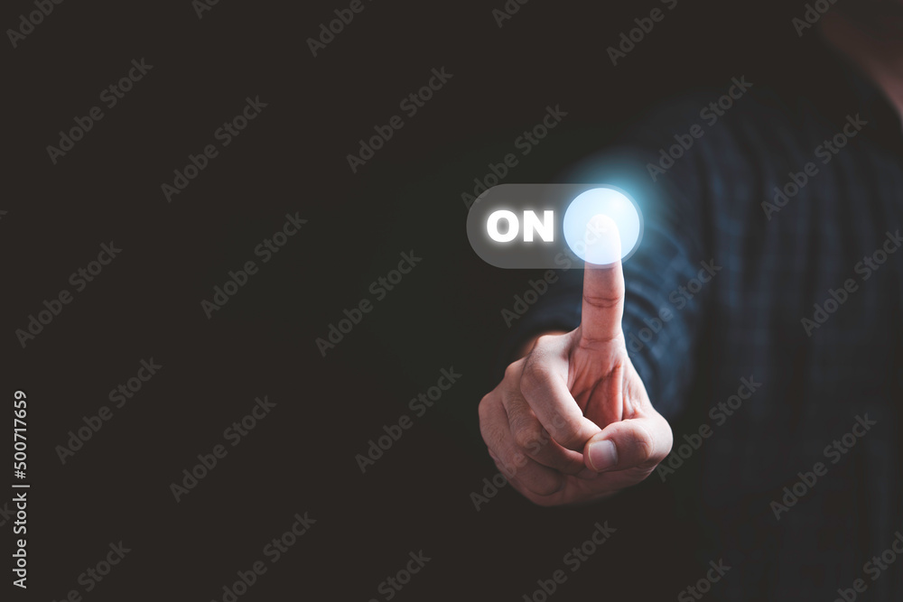 Businessman touching to virtual toggle switch button for change from off to on. Businessman touching to virtual toggle switch button for change from off to on.