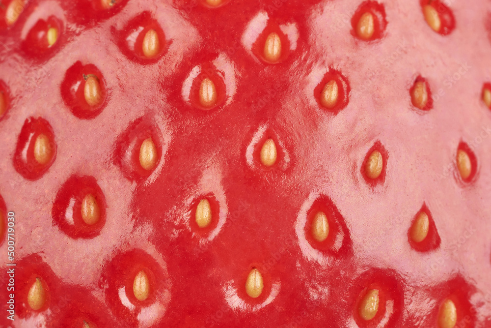 Background of strawberry surface. Red strawberry close-up macro Background of strawberry surface. Red strawberry close-up macro