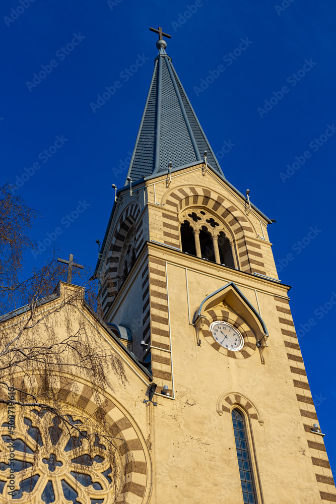  tower of a catholic church with a clock