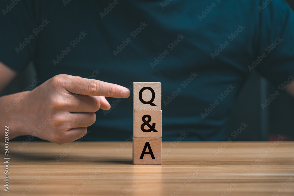 questions and answers. businessman hand choose Q and a on a wooden block. Answers, ask questions, information, communication, and brainstorming. doubt, interrogate, problem, query, subject questions and answers. businessman hand choose Q and a on a wooden block. Answers, ask questions, information, communication, and brainstorming. doubt, interrogate, problem, query, subject