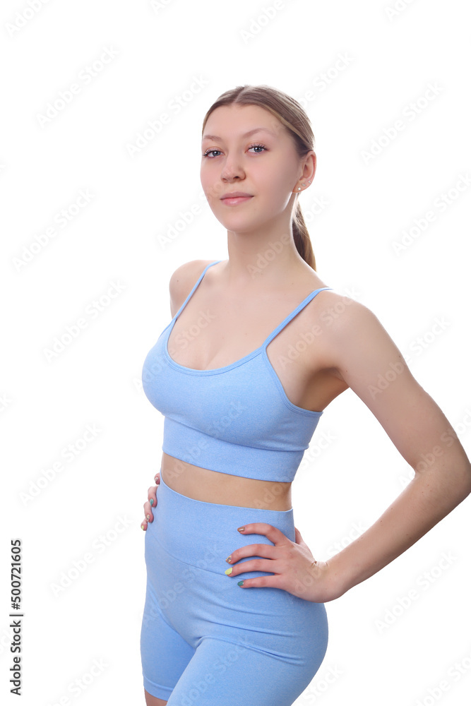 young girl in a sports outfit on a white background