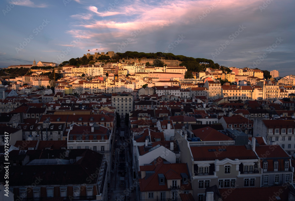 Cityscape by sunset with cloudy sky in the background, Lisbon, Portugal. Touristic sightseeing 