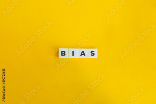 Bias Word on Letter Tiles on Yellow Background. Minimal Aesthetics. photo