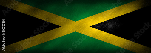 The flag of Jamaica on a retro looking background