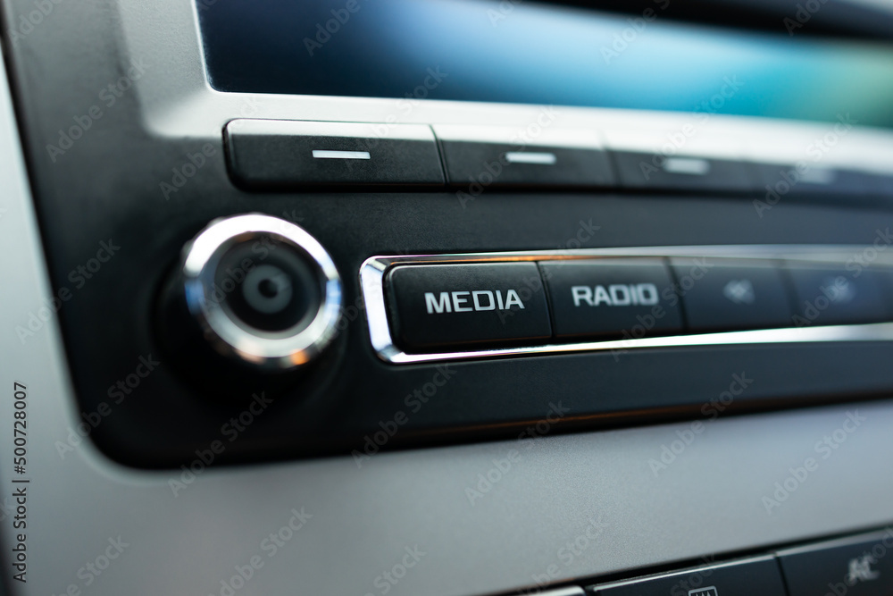 car audio media control panel. macro. auto sound repair service. media button close up