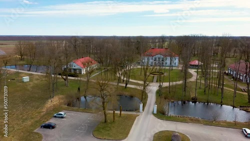 Amazing Aerial View Bistrampolis Palace and Parkin Lithuania, Panevezys District. Historic Palace in the Neoclassical Style. 4K UHD Resolution
 photo