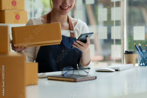 Asian small business owner working at home office. Business retail market and online sell marketing delivery, SME e-commerce concept. © itchaznong