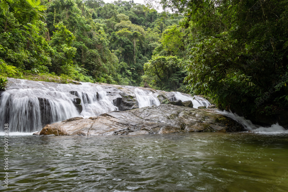 Obraz premium Waterfall of the Ribeirão de Itu river in Boicucanga in the Atlantic Forest in the state of São Paulo - Brazil