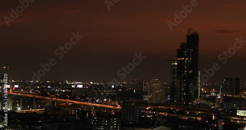 Wallpaper Mural High-angle 4K video that sees condominiums of various sizes encircling the city center, business district, and blurry lights and passing cars during the evening twilight sky. Torontodigital.ca
