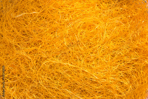 Golden silk threads from yellow cocoons. Golden silk cocoon shell.