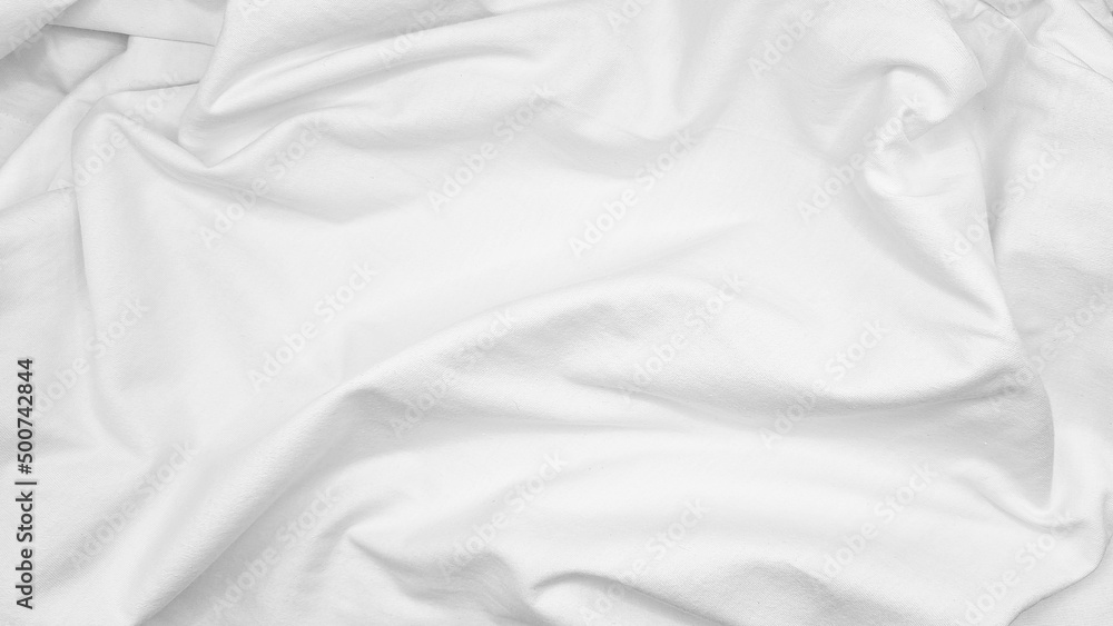 natural fabric cloth texture used for design. drapery textured. canvas for background. image has shallow depth of field. white cloth texture background for romantic or stylish mood and tone.