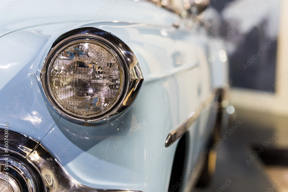 Classic Blue Antique Car Headlight with copy space and blurred background