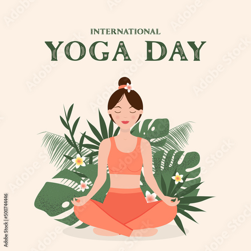 International Yoga Day. Woman doing yoga in lotus position, against the background of tropical leaves and flowers.