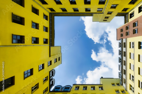 yellow square building on sky background