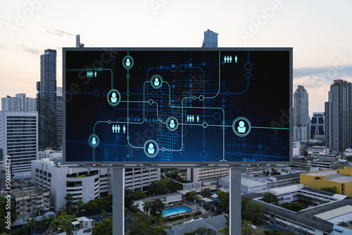 Glowing Social media icons on billboard over sunset panoramic city view of Bangkok. The concept of networking and establishing new connections between people and businesses in Southeast Asia