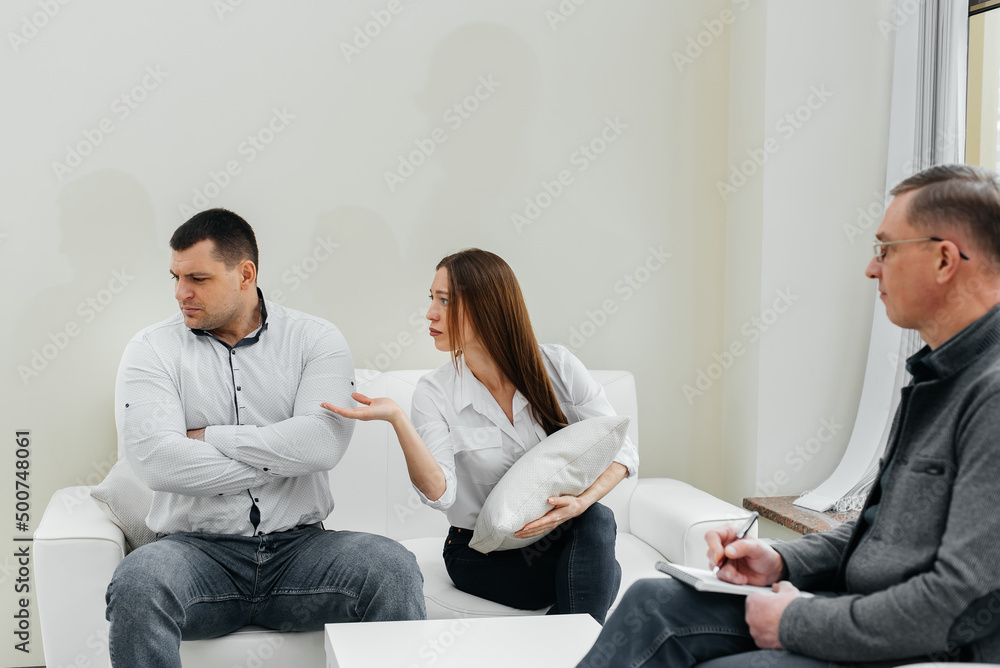 A young married couple came to an appointment and consultation with a psychotherapist. Counseling and help during depression and solving family problems. Communication with a psychologist. A young married couple came to an appointment and consultation with a psychotherapist. Counseling and help during depression and solving family problems. Communication with a psychologist.
