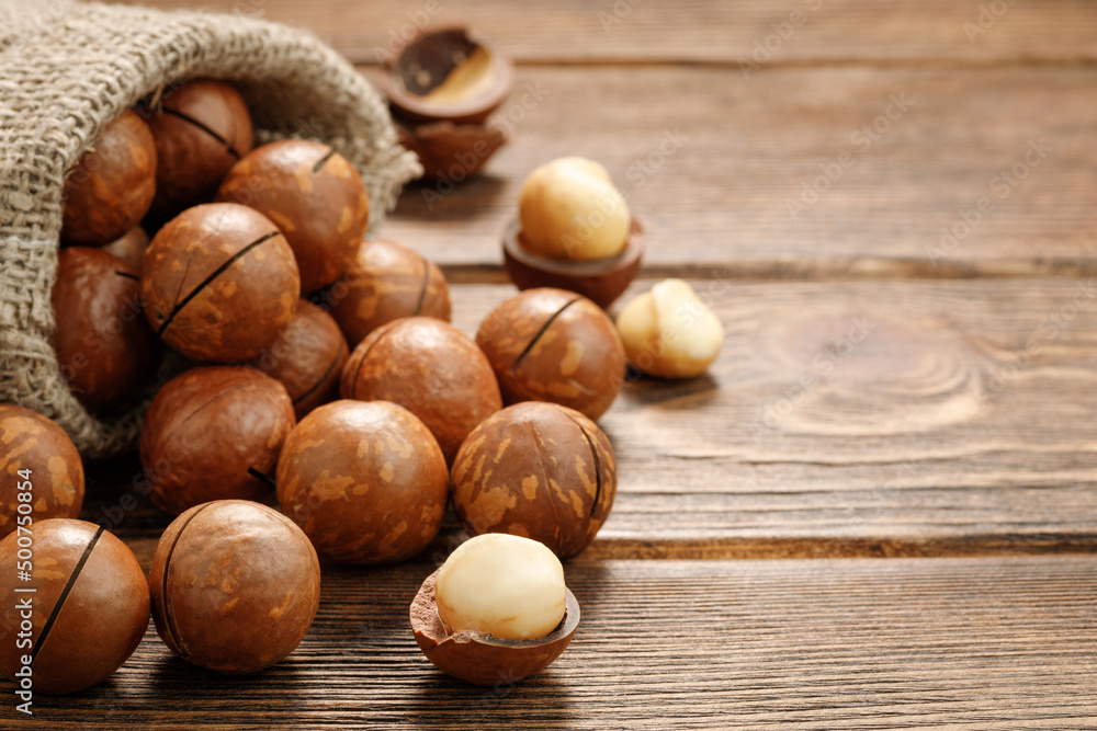 Macadamia nuts on a wooden table. Macadamia nuts on a wooden table.