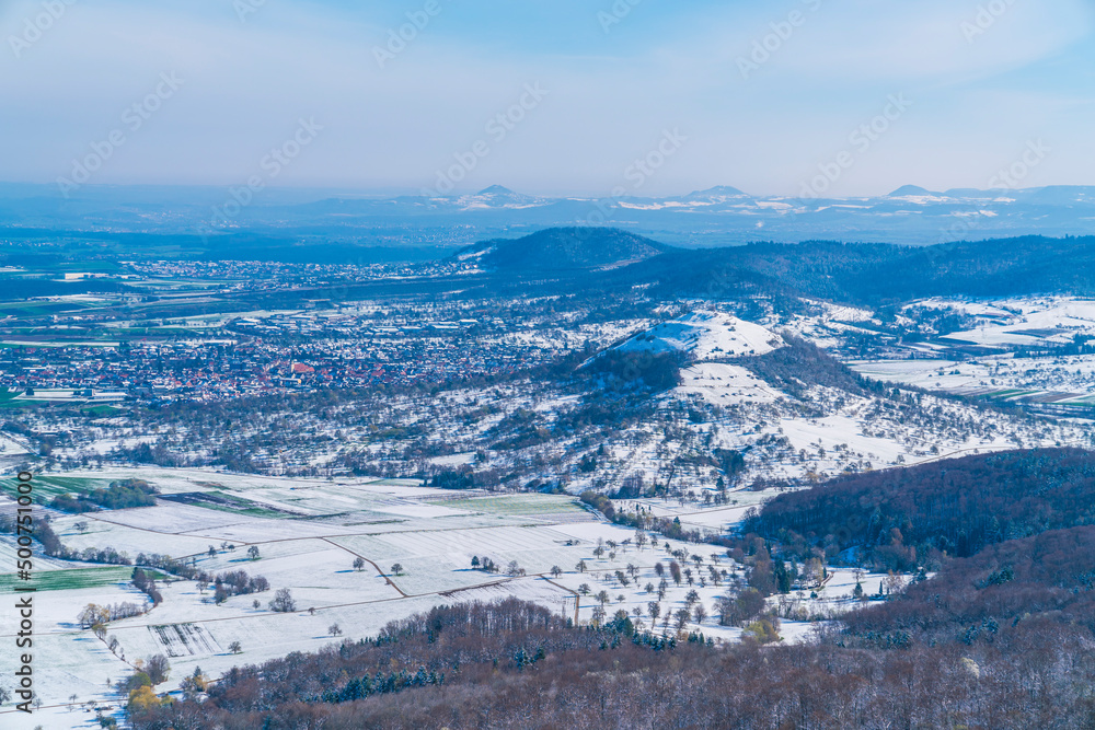 Germany, Aerial panorama view above swabian jura mountains in winter wonderland scene covered with snow around limburg and kirchheim houses