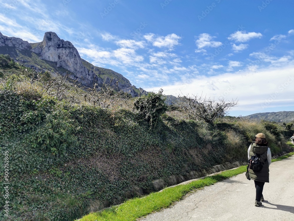 hiking in the mountains. surrounded by green fields and blue skies. alicantina. unrecognisable person. copy space