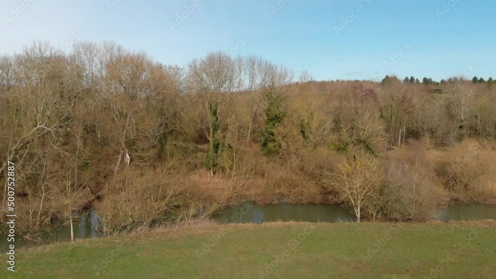 A slow flight towards the River with trees, UK in winter A slow flight towards the River with trees, UK in winter