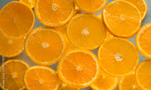Healthy natural product. Orange slices on a light background. Juicy citrus fruits. Top view