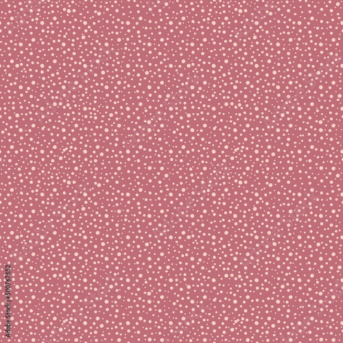 Cute polka dots seamless vector pattern background. Random painted pink, gold, yellow dot shapes backdrop. Dense circle confetti texture. Graphic style textural design element.