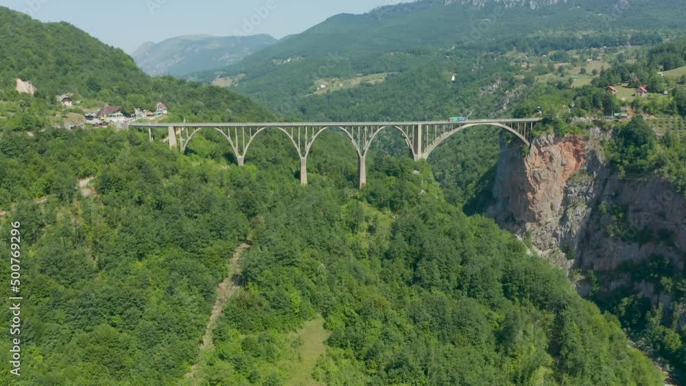Truck drives over an arched bridge in Montenegro Truck drives over an arched bridge in Montenegro