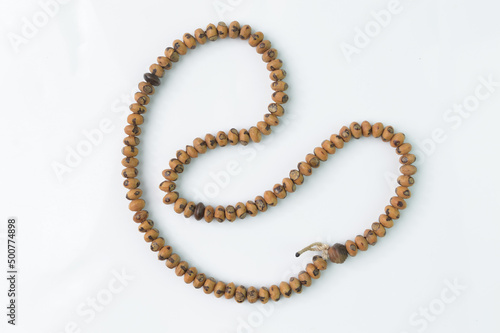 Wooden prayer beads isolated on a white background