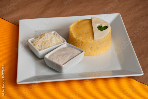 Banush - viscous corn porridge cooked in cream or sour cream and seasoned with cheese photo