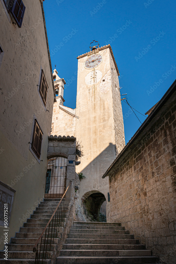 Fototapeta premium Clock tower and bell tower of the church of Saint Rocco in the old town of Omis, Croatia