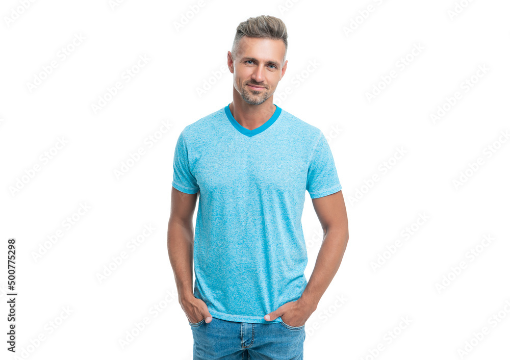 Happy handsome caucasian guy smiling in casual style holding hands in pockets isolated on white Happy handsome caucasian guy smiling in casual style holding hands in pockets isolated on white