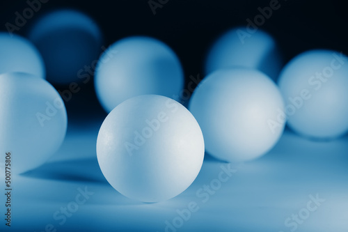 Many blue balls are on the table. Business concept.