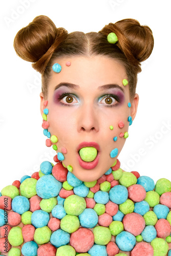 Voluminous body art. Girl with colored balls on her body. Volume balls on the body. Cheerful girl with bubbles on her body. Surprised girl with a ball in her mouth.