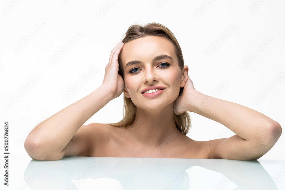 Portrait of young beautiful woman touching her face isolated over white background. Cleaning face, perfect skin. SPA therapy, skincare, cosmetology, hair removal or plastic surgery concept Portrait of young beautiful woman touching her face isolated over white background. Cleaning face, perfect skin. SPA therapy, skincare, cosmetology, hair removal or plastic surgery concept