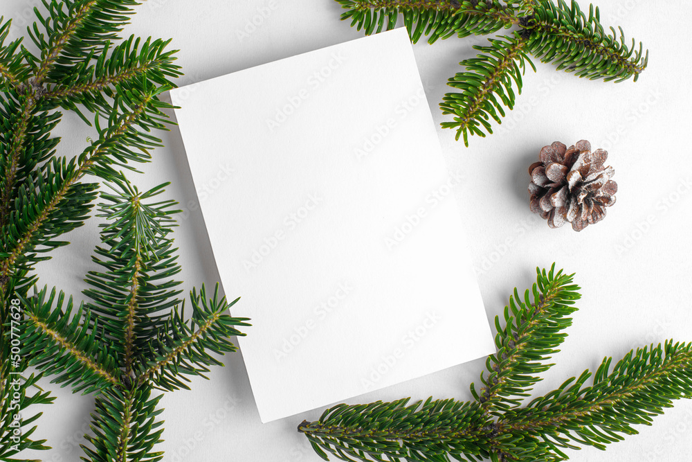 Christmas 5x7 card mockup template with fir twigs on white background. Design element for Christmas and New Year congratulation, rsvp, thank you, greeting or invitation card Christmas 5x7 card mockup template with fir twigs on white background. Design element for Christmas and New Year congratulation, rsvp, thank you, greeting or invitation card