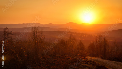 Bright sunset or dawn in a mountainous area © SerPhoto
